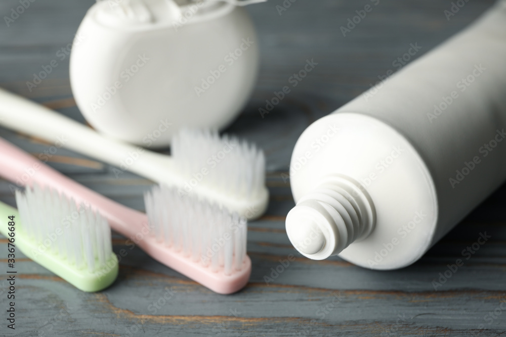 Tools for dental care on wooden background, close up Tools for dental care on wooden background, close up