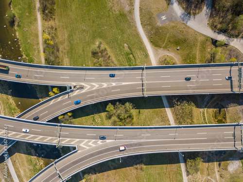 Aerial view of highway intersection with overpass in Switzerland. Large motorway bridge for car traffic.