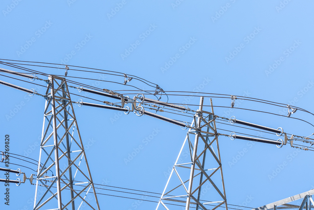Close up eletrical tower on blue sky