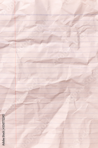 Top view vertical empty rumpled lined paper with wrinkled. Notebook lined paper background and texture.