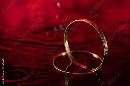 dramatic wedding rings in red water