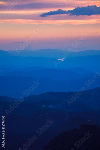 Indian sunset in South India Niligiri mountains in Western Ghats. Pothamedu viewpoint, Munnar, Kerala, India © Dmitry Rukhlenko