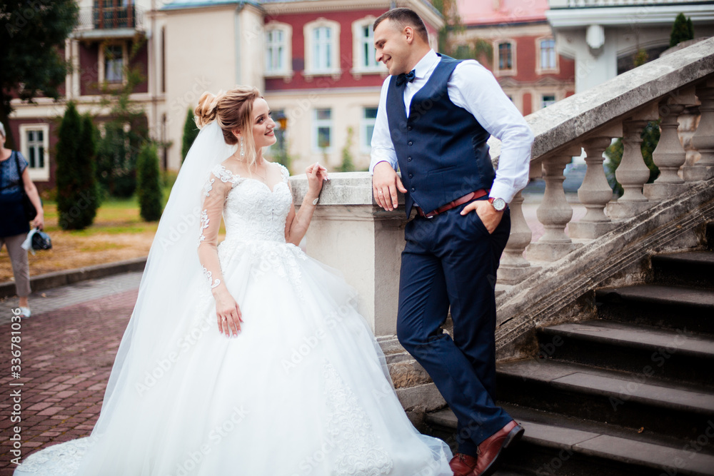 Fototapeta premium Wedding wedding day beautiful bride and elegant groom walking after wedding luxury