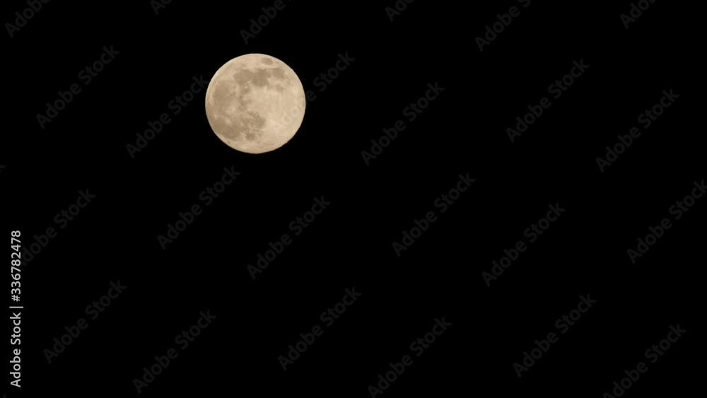 Full moon that moves on long focus at night Full moon that moves on long focus at night