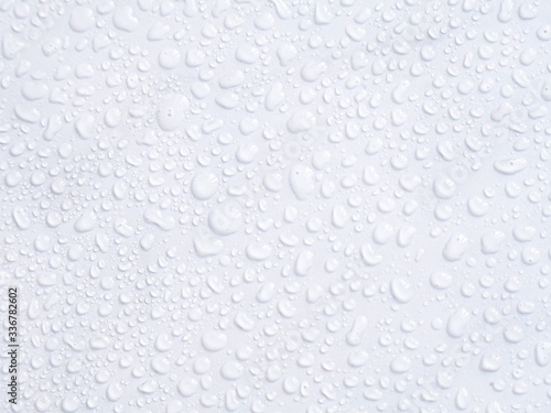 Water drops on white marble background, texture, top view, copyspace, space for design. Wall after shower in bathroom concept