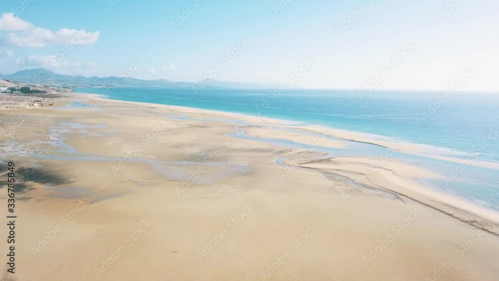 HOLIDAYS 4K Aerial panoramic view of sand beach lagoon. Tourist destination for extreme water sports. Healthy and active lifestyle concept. HOLIDAYS 4K Aerial panoramic view of sand beach lagoon. Tourist destination for extreme water sports. Healthy and active lifestyle concept.