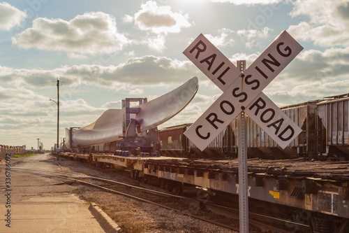 April 7, 2020 - Galveston TX/USA: Wind turbine blade on railroad train flatcar at the Port of Galveston Texas photo