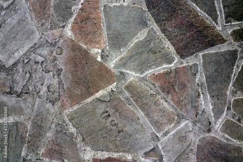 masonry wall paving stones as a background close up