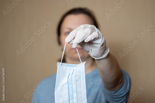medical mask in a woman's hand