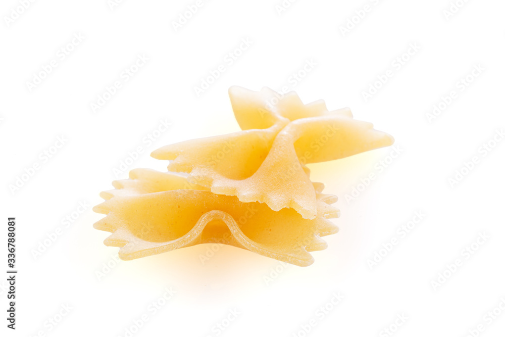 Farfalle - dry pasta isolated on a white background . A variety of types and forms of Italian pasta. Farfalle - dry pasta isolated on a white background . A variety of types and forms of Italian pasta.