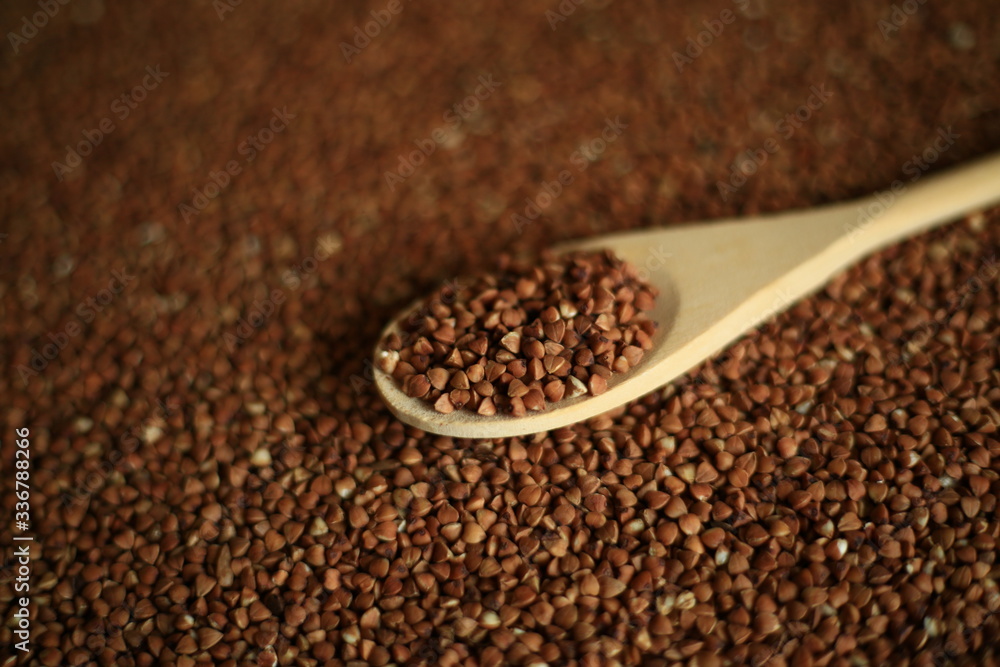 buckwheat in wooden spoon macro buckwheat in wooden spoon macro