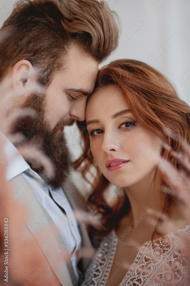 close portrait of a red-haired girl and a bearded guy close portrait of a red-haired girl and a bearded guy