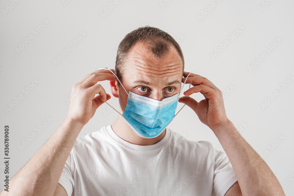 Young man wearing protection face mask against coronavirus. Young man wearing protection face mask against coronavirus.