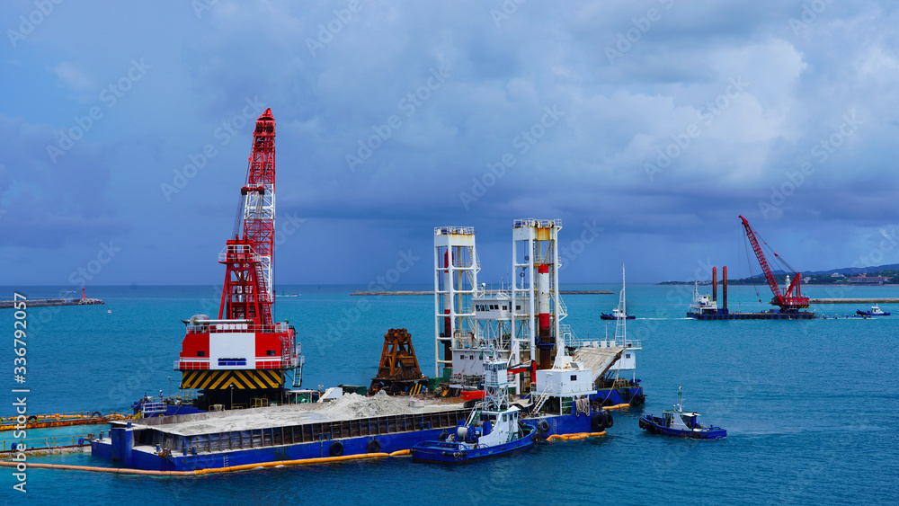 Sand Racking Japan a floating crane platform extracts white sand from the bottom of the ...