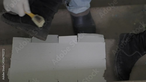 Cleaning black boots with a brush.  Cleaning black shoes from dirt. 
