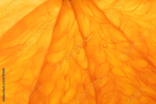Bright juicy orange pulp close-up. High-quality image is suitable for topics: healthy lifestyle, vitamins, proper nutrition, diet, summer, fresh juices. Background fruit texture. photo