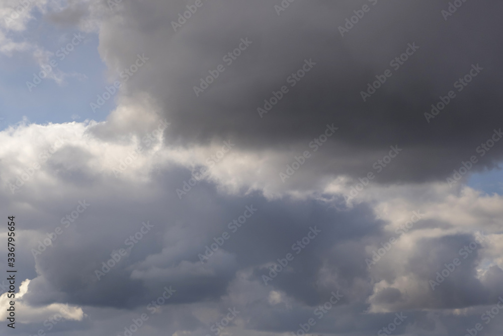 Blue sky background with tiny stratus cirrus striped clouds. Clearing day and Good windy weather Blue sky background with tiny stratus cirrus striped clouds. Clearing day and Good windy weather