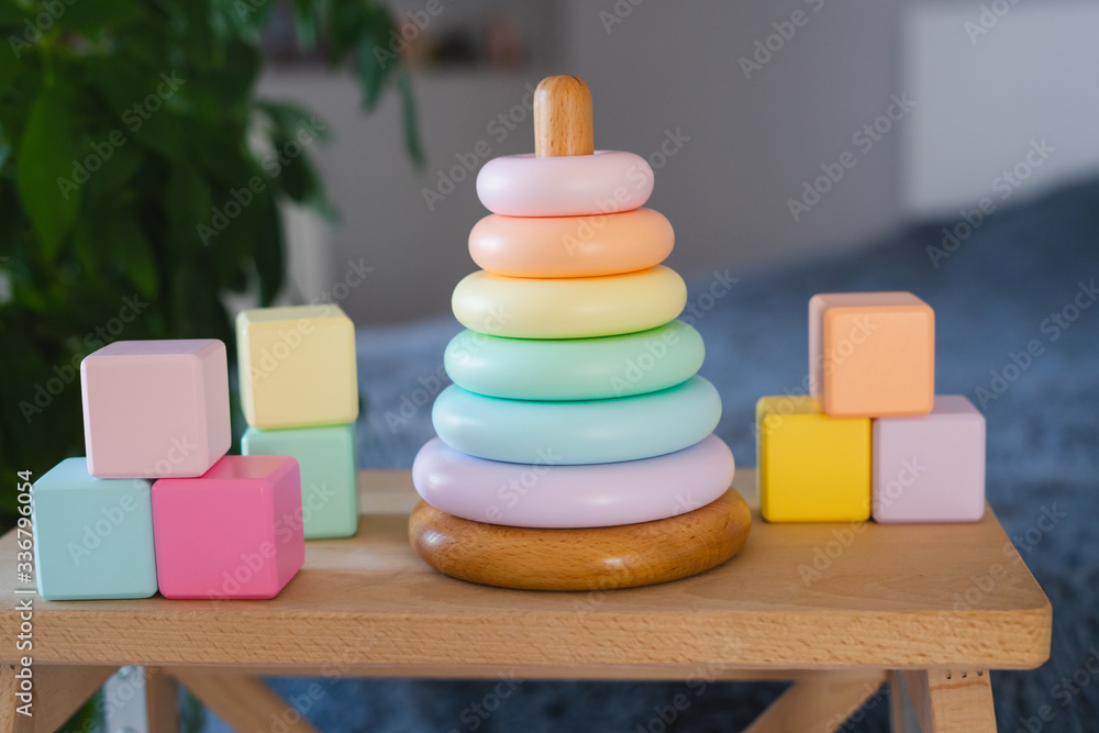 Children's toys made of natural materials. Wooden cubes and a pyramid. Children's toys made of natural materials. Wooden cubes and a pyramid.