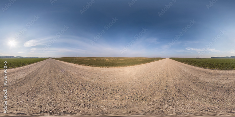 full seamless spherical hdri panorama 360 degrees angle view on gravel road among fields in spring day with clear sky in equirectangular projection, ready for VR AR virtual reality content