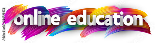 Online education sign over brush strokes background.