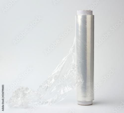 big roll of wound white transparent film for wrapping food, white background