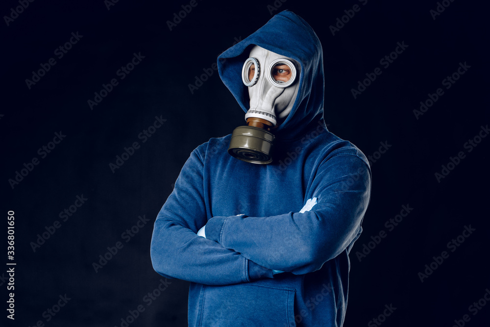 Portrait of a man in a gas mask. Panic during quarantine. Coronavirus pandemia concept Portrait of a man in a gas mask. Panic during quarantine. Coronavirus pandemia concept