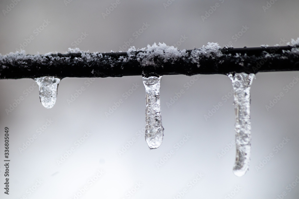 Icicles hanging from the wire Icicles hanging from the wire