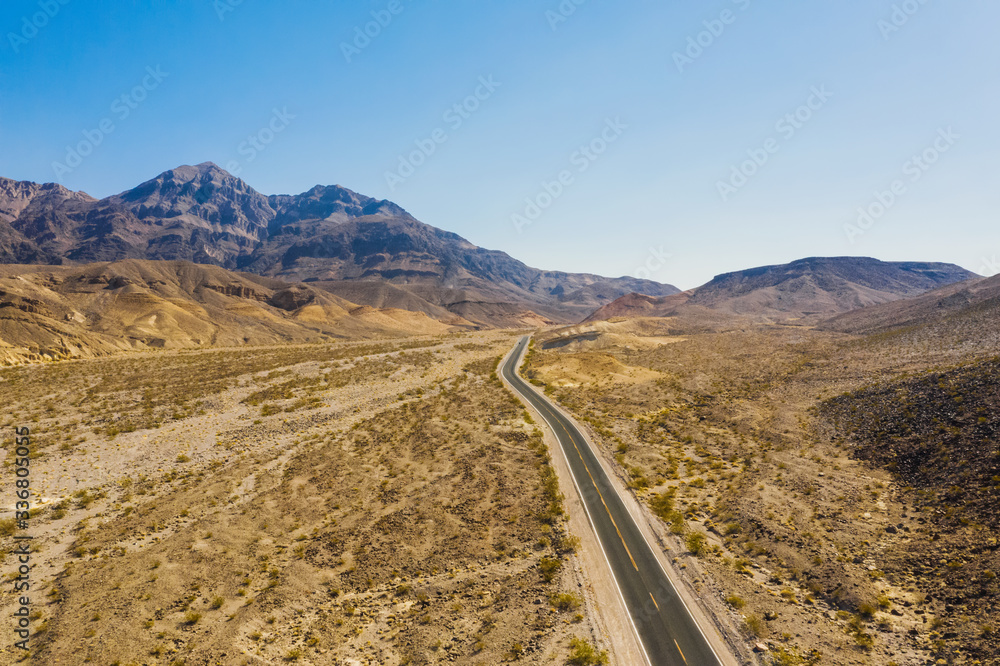 Aerial top view of the mountains and highway road in Death Valley national park, USA country