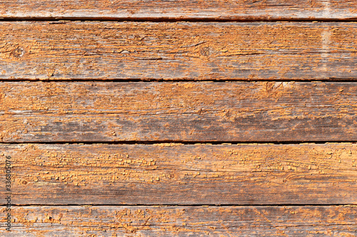 wooden background. cracked paint. rough, weathered surface