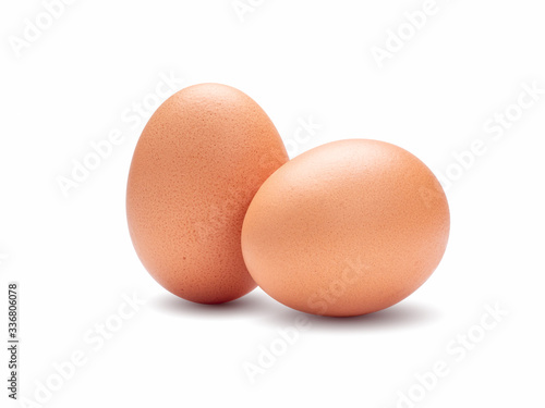 Close-up at two chicken egg isolated on white background.