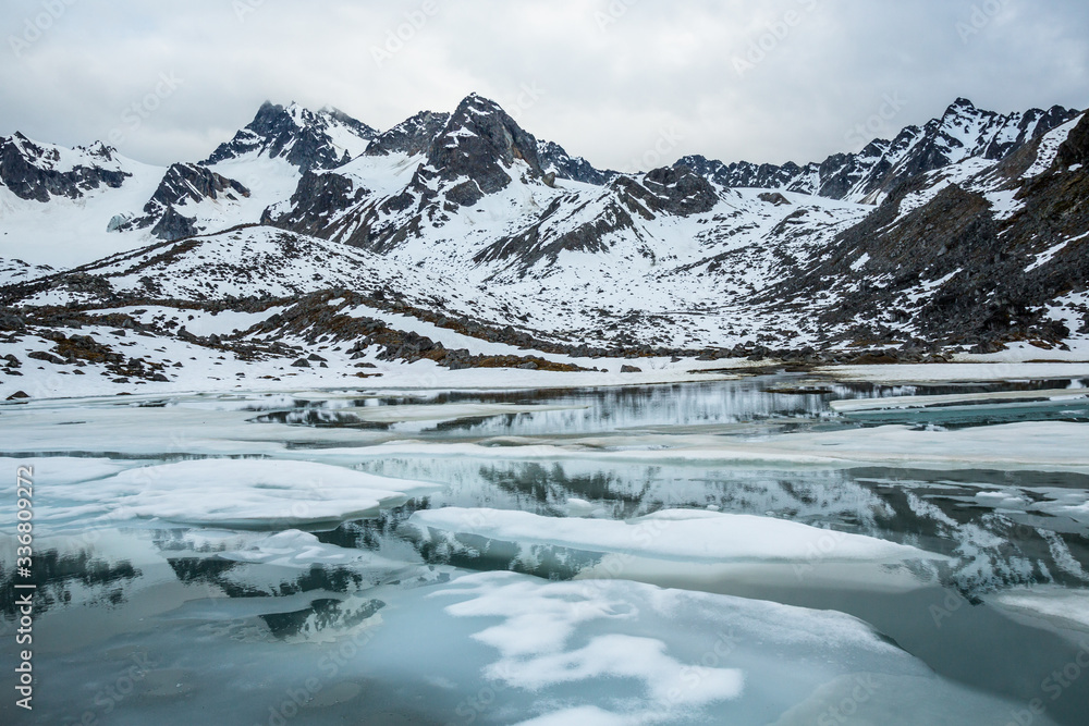 Spring thaw on a backcountry lake below Montana Peak. Remote Alaskan wildernes.