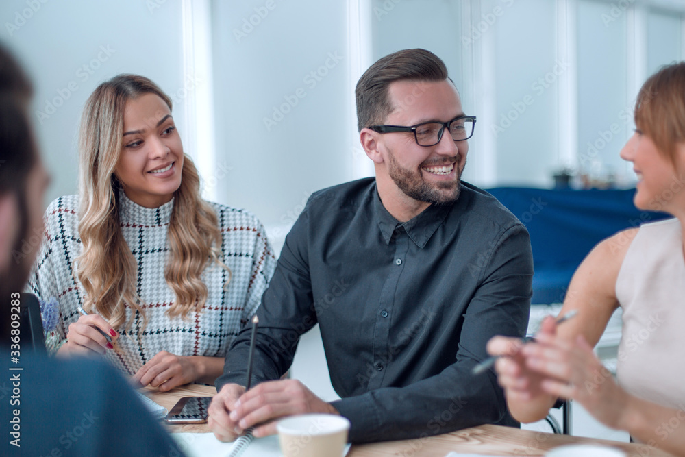 business team discussing business issues over a Cup of coffee business team discussing business issues over a Cup of coffee