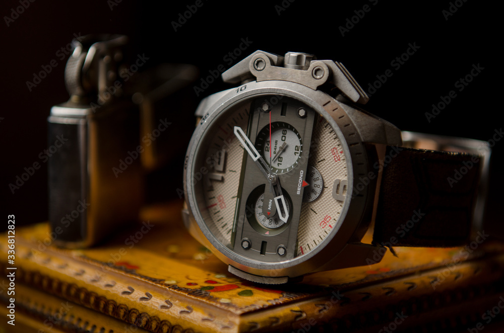 Fototapeta premium Retro steel watch with leather strap on wooden box.