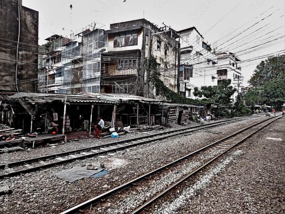 Train track in Bangkok and some wood cabins next to it hdr