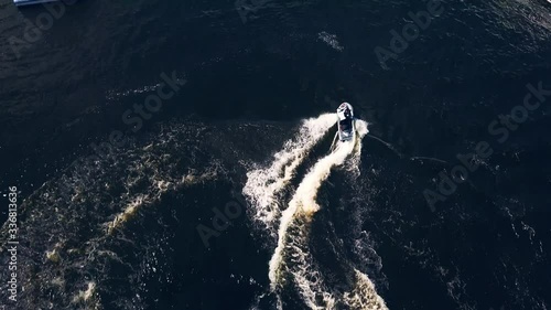 Aerial view of Jet Ski Doing Spins at Dusk photo