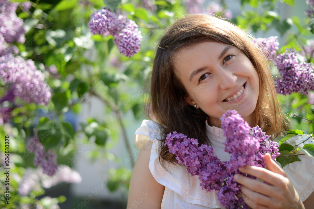 young woman with lilac flowers young woman with lilac flowers