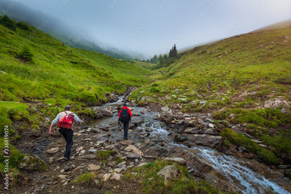 Fototapeta premium Exploring the mountains of Romania, epic landscapes and low clouds ahead