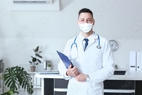 Male doctor wearing protect...