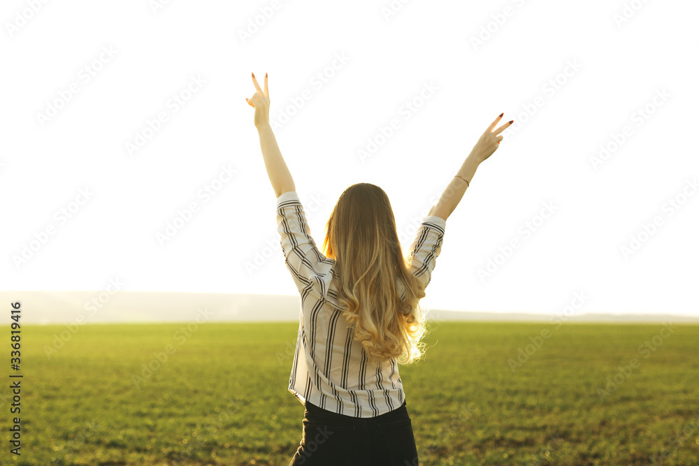 Successful young woman on green field at sunset.
Concept of freedom, well-being, adventure, travel, trip, vacation, lifestyle. Successful young woman on green field at sunset.
Concept of freedom, well-being, adventure, travel, trip, vacation, lifestyle.