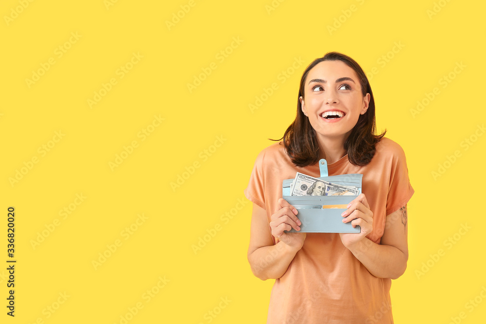Young woman with wallet on color background Young woman with wallet on color background