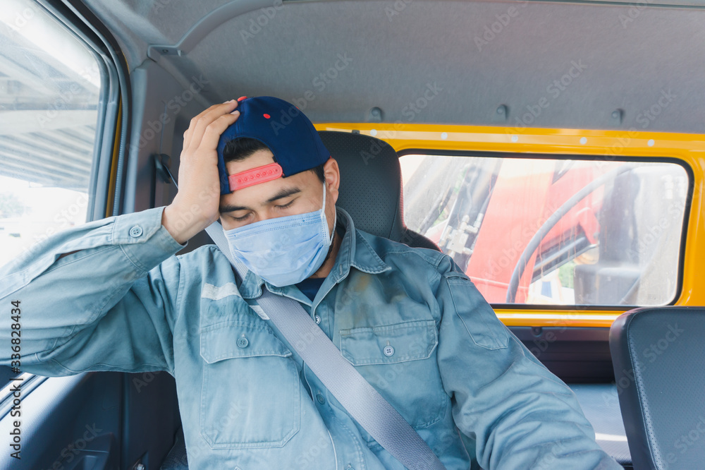 Truck drivers wear a medical facemask for protection. During the coronavirus outbreak