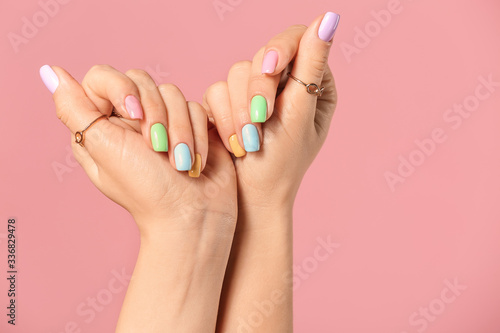 Fototapeta Hands of young woman with beautiful manicure on color background