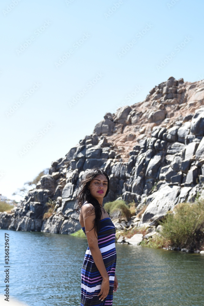 Spectacular middle eastern young woman is posing on the Nile Spectacular middle eastern young woman is posing on the Nile