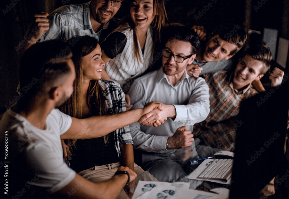 Fototapeta premium handshake of business people in the circle of colleagues