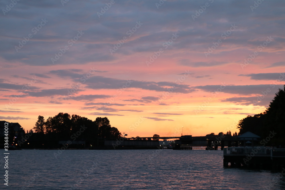 Multicoloured sunset on the river