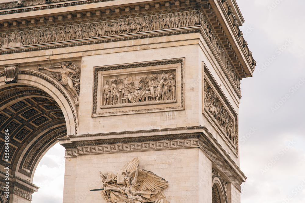 Architectural fragment of Arc de Triomphe. Arc de Triomphe de l'Etoile on Charles de Gaulle Place is one of the most famous monuments in Paris. Architectural fragment of Arc de Triomphe. Arc de Triomphe de l'Etoile on Charles de Gaulle Place is one of the most famous monuments in Paris.