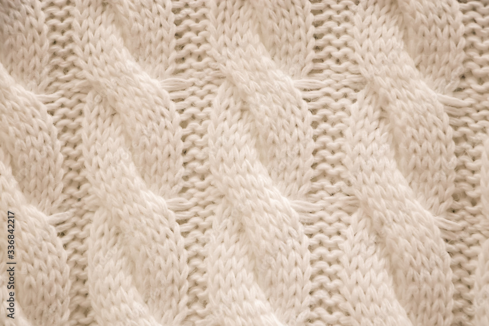The texture of a knitted sweater. Knitting, home accessories. The texture of a knitted sweater. Knitting, home accessories.