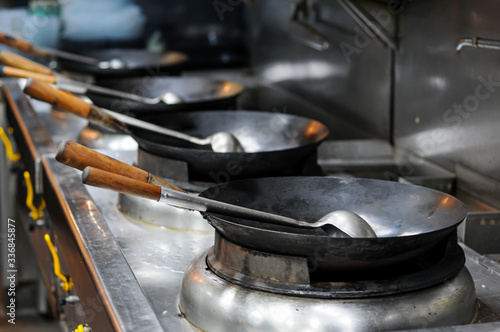 iron wok in restaurant kitchen