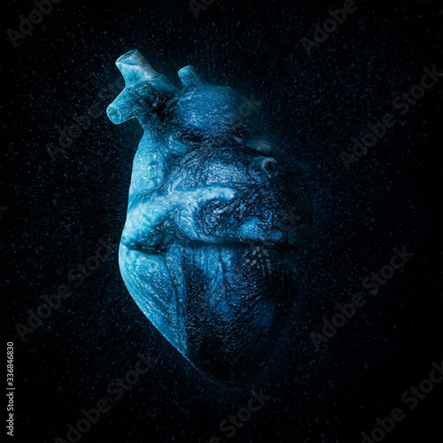 An ice cold blue heart Over black