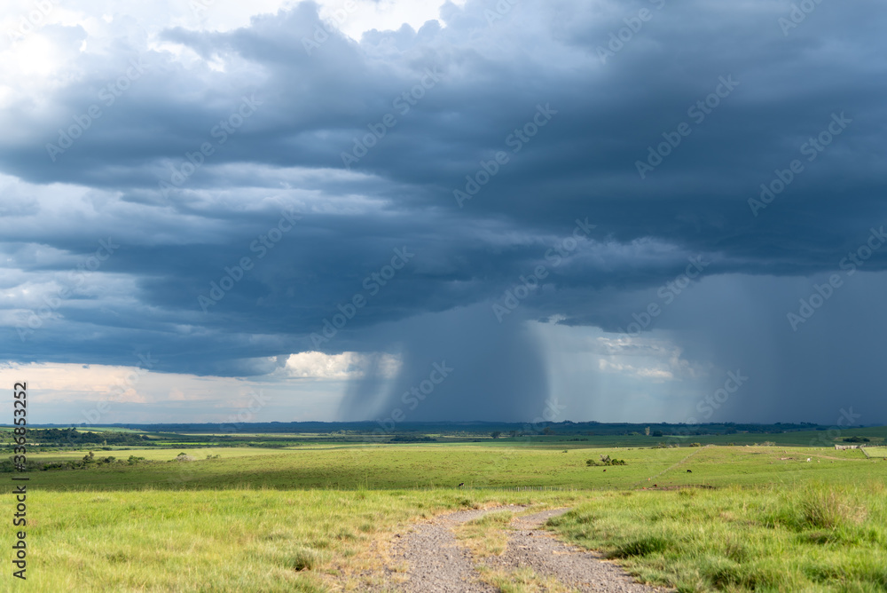 Farm area in southern Brazil and Cumulunimbus Clouds causing rain in summer afternoon